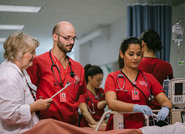 Nursing professor observing her students